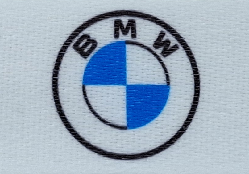 Logo of the BMW car brand with blue and white color fields in a round, black frame.