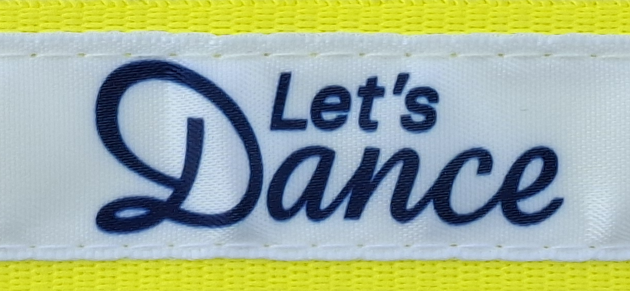 White label with the inscription "Let's Dance" on a yellow background.